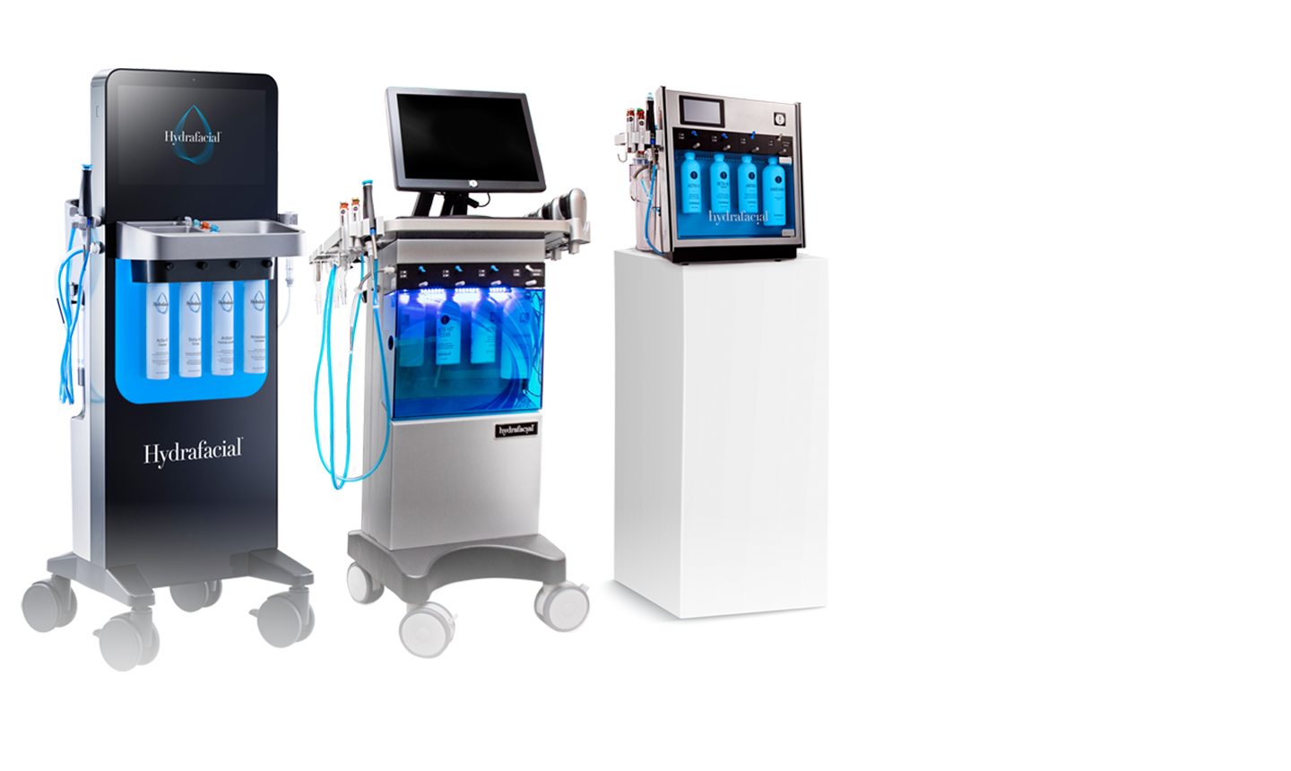 Three Hydrafacial devices side by side, showing different models with illuminated blue serum bottles and screen displays.